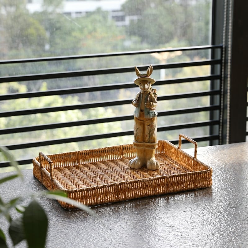 Faux rattan storage tray with sturdy handles – shown in a room setting
