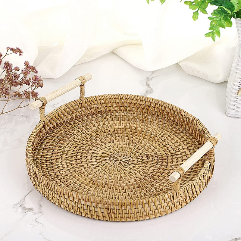 Light beige rattan serving tray with solid wood handles – shown in a room setting