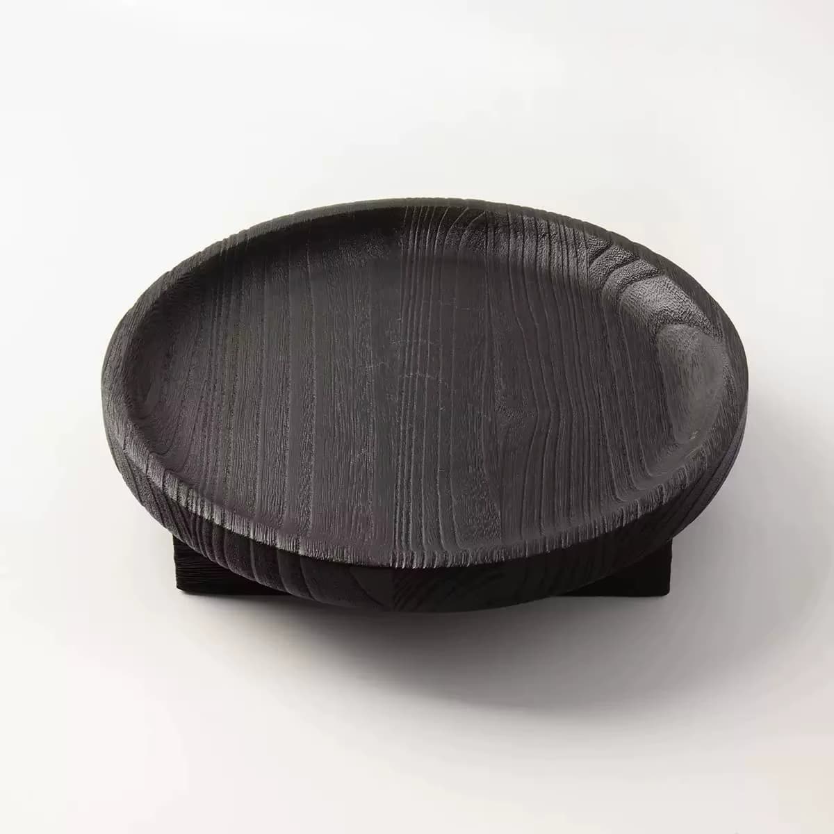 Round turned wood fruit tray with a slightly raised rim