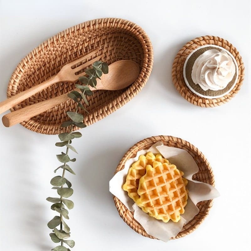 Oval genuine rattan tray with side handles – shown in a room setting (2)