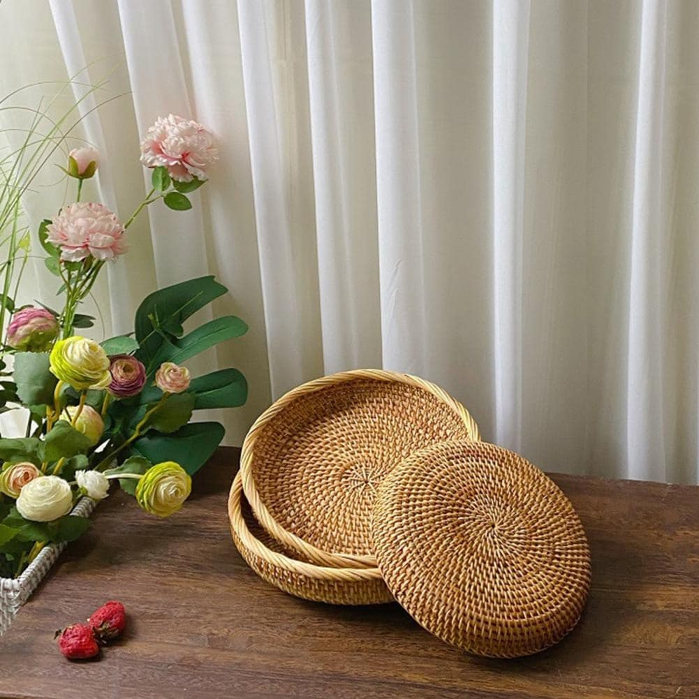 Round genuine rattan tray with natural ribs and a rounded border – shown in a room setting