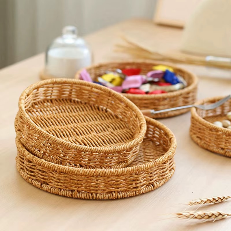 Boho round rattan tray in golden beige – shown in a room setting