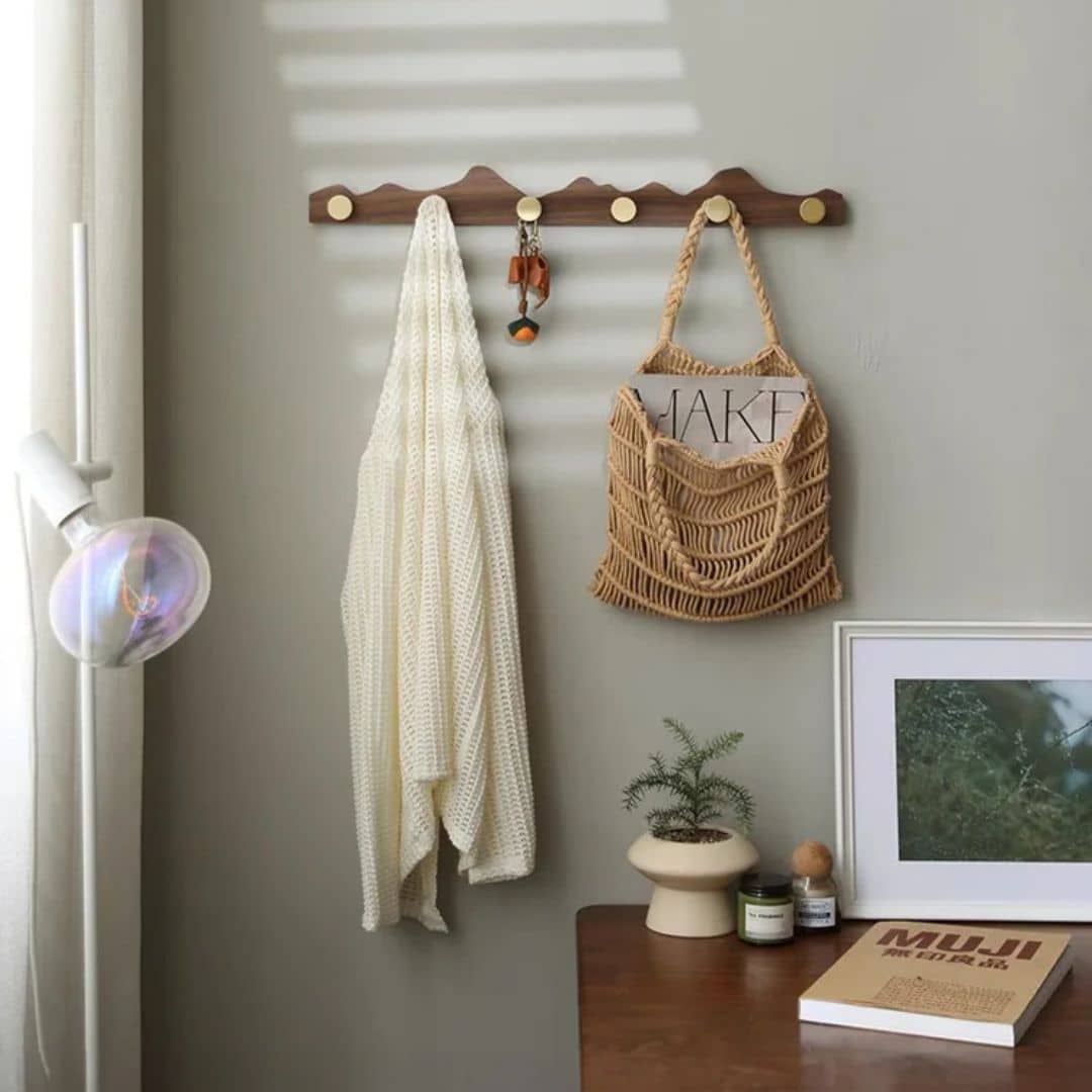 Wooden wall coat rack with gold-finish hooks – shown in a room setting (3)