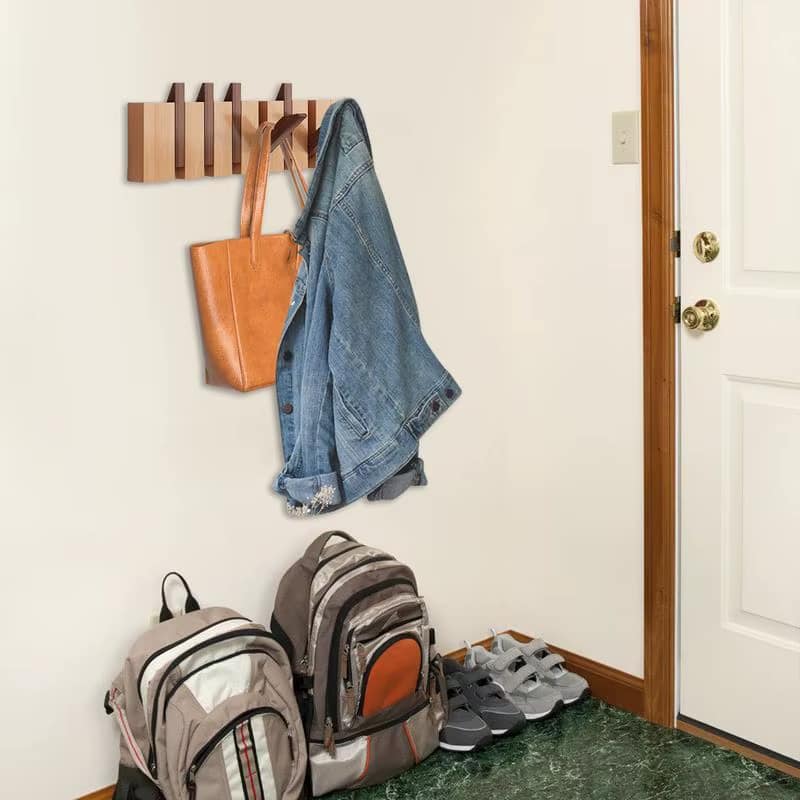 Wooden piano key wall hook rack with flip-down hooks – shown in a room setting