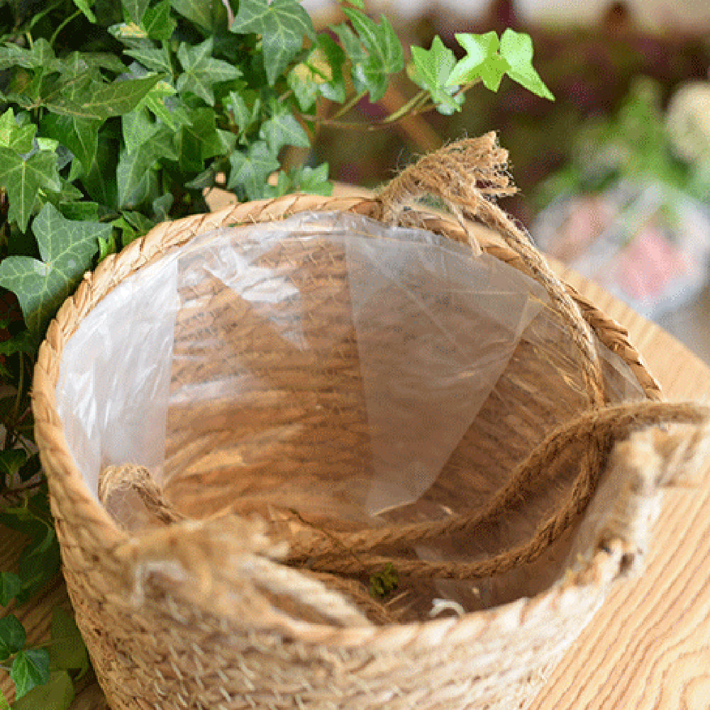 Hanging natural rattan plant holder with a round frame and fringes – close-up detail