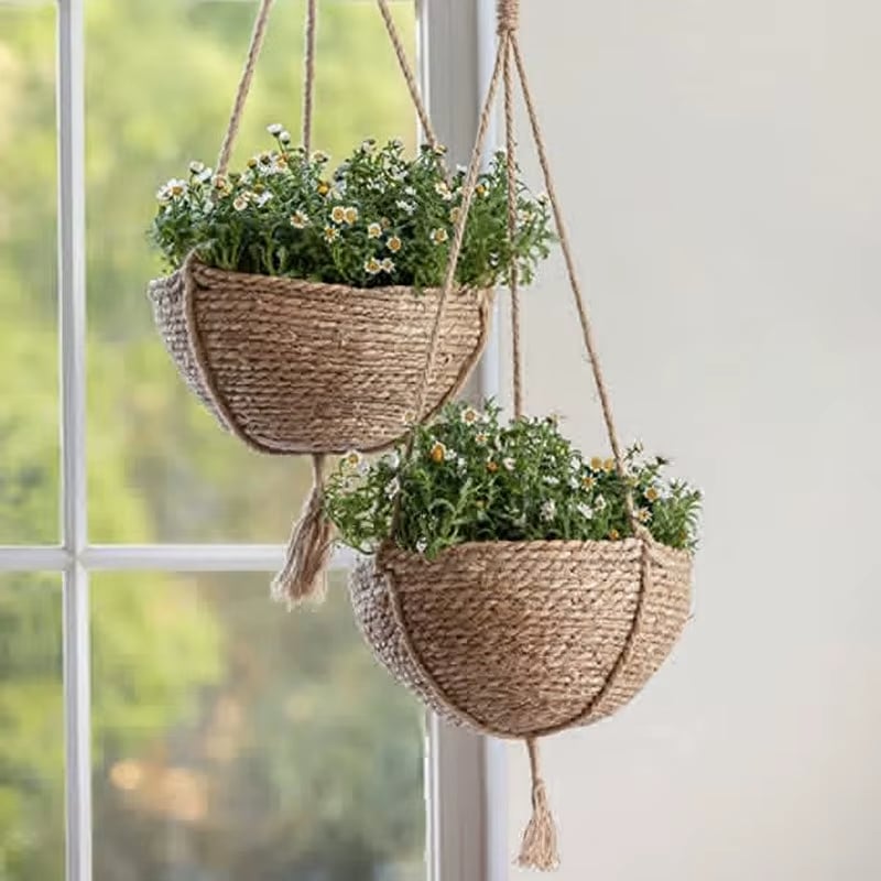 Boho hanging rattan planter with a rounded shape – shown in a room setting (2)
