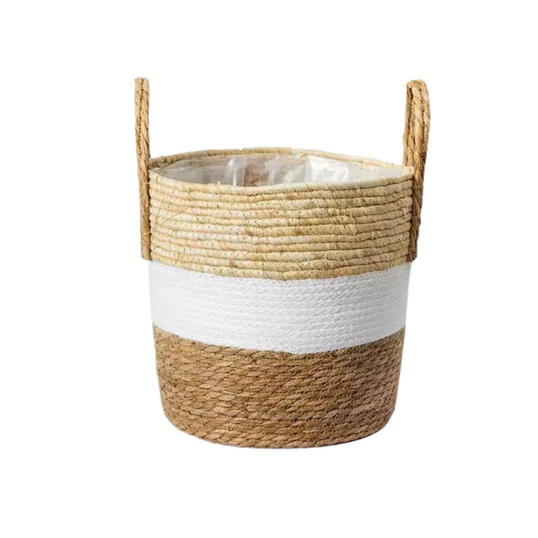 Round hand-braided rattan planter with a natural finish