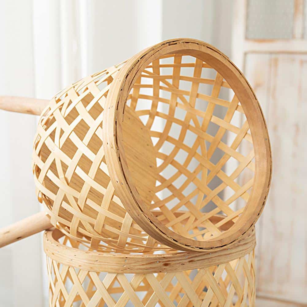Freestanding handwoven rattan planters on a patio