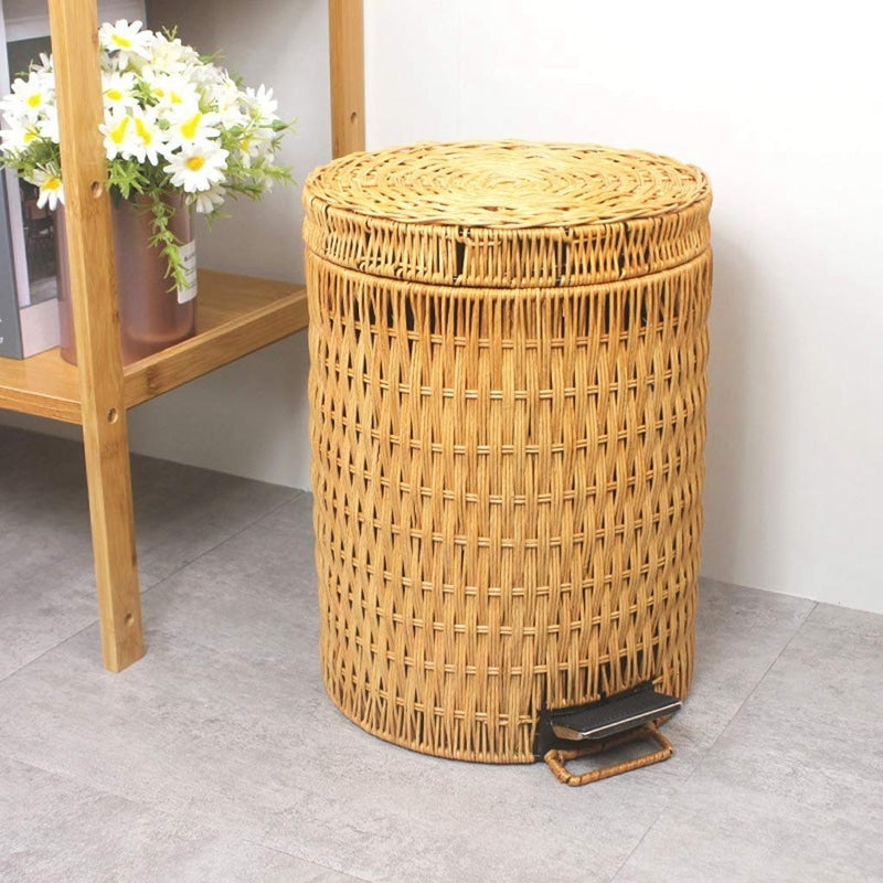Woven rattan trash can with a foot pedal – shown in a room setting