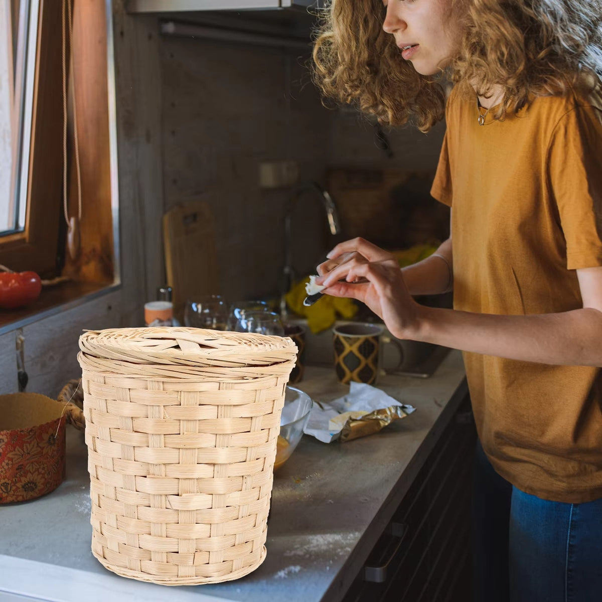 Round hand-braided woven wastebasket with a lid – shown in use (2)
