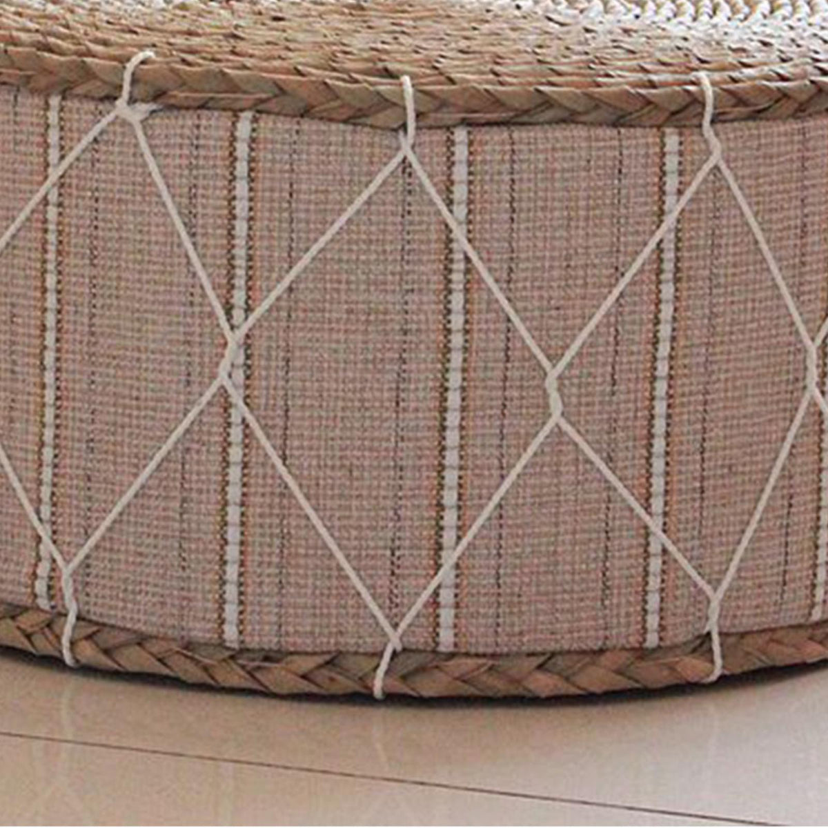 Round beige pouf with a hand-braided rattan frame – close-up detail