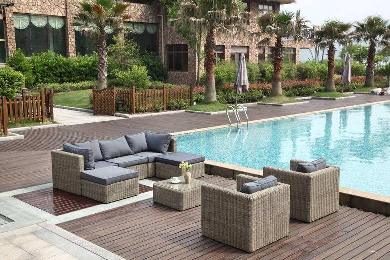 Liberty round resin wicker outdoor ottoman – shown outdoors (2)