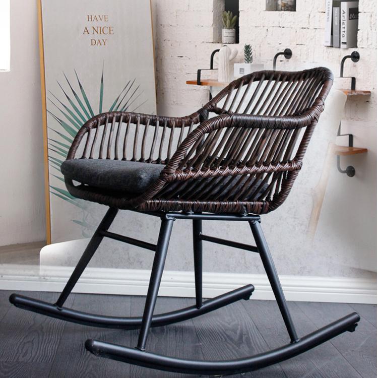 Dark brown hand-braided rattan rocking chair – shown in a room setting