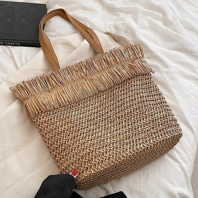 Large brown straw crossbody bag with fringe