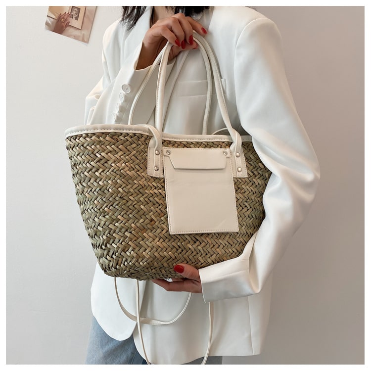 Large handmade yellow straw summer bag – worn by a model
