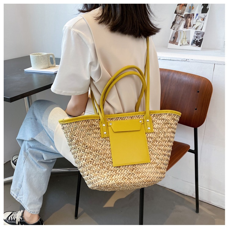 Large handmade yellow straw summer bag – worn by a model (2)