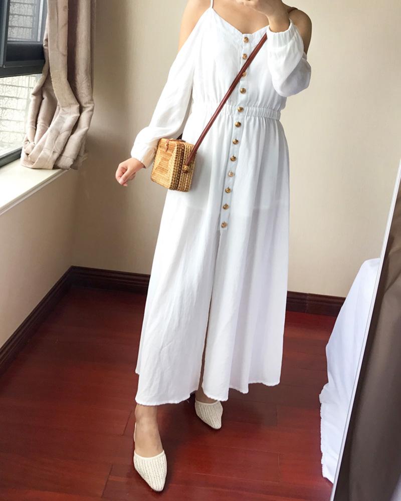 Compact rectangular hand-braided rattan bag – worn by a model (2)