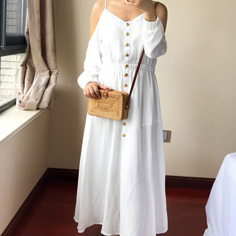 Compact rectangular hand-braided rattan bag – worn by a model