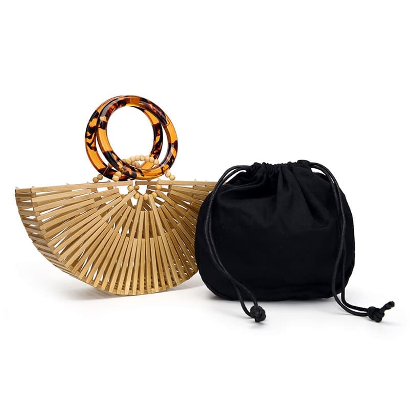 Carved wood handbag with woven accents – close-up detail