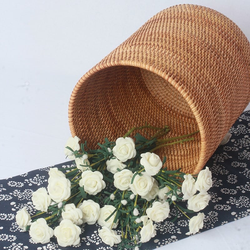 Cylindrical woven rattan storage bucket – shown in a room setting