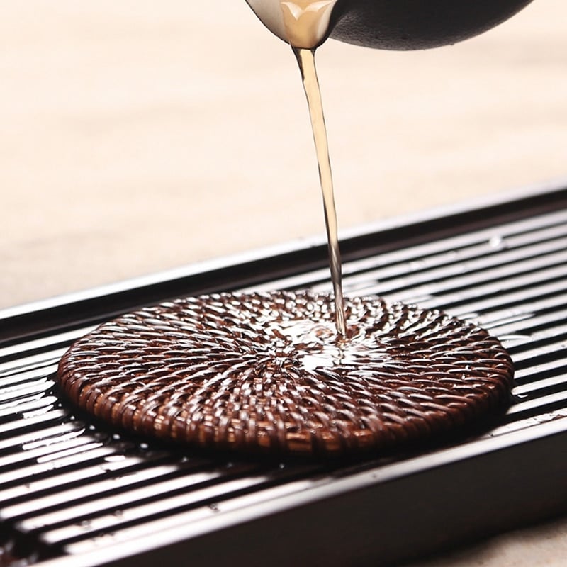 Set of six handwoven rattan drink coasters – shown in a room setting (2)
