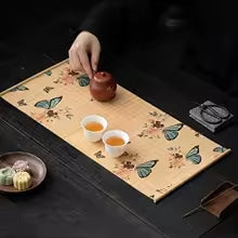 Bamboo placemat with deep blue butterfly motifs – shown in a room setting