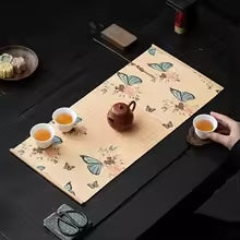 Bamboo placemat with deep blue butterfly motifs – shown in a room setting (2)