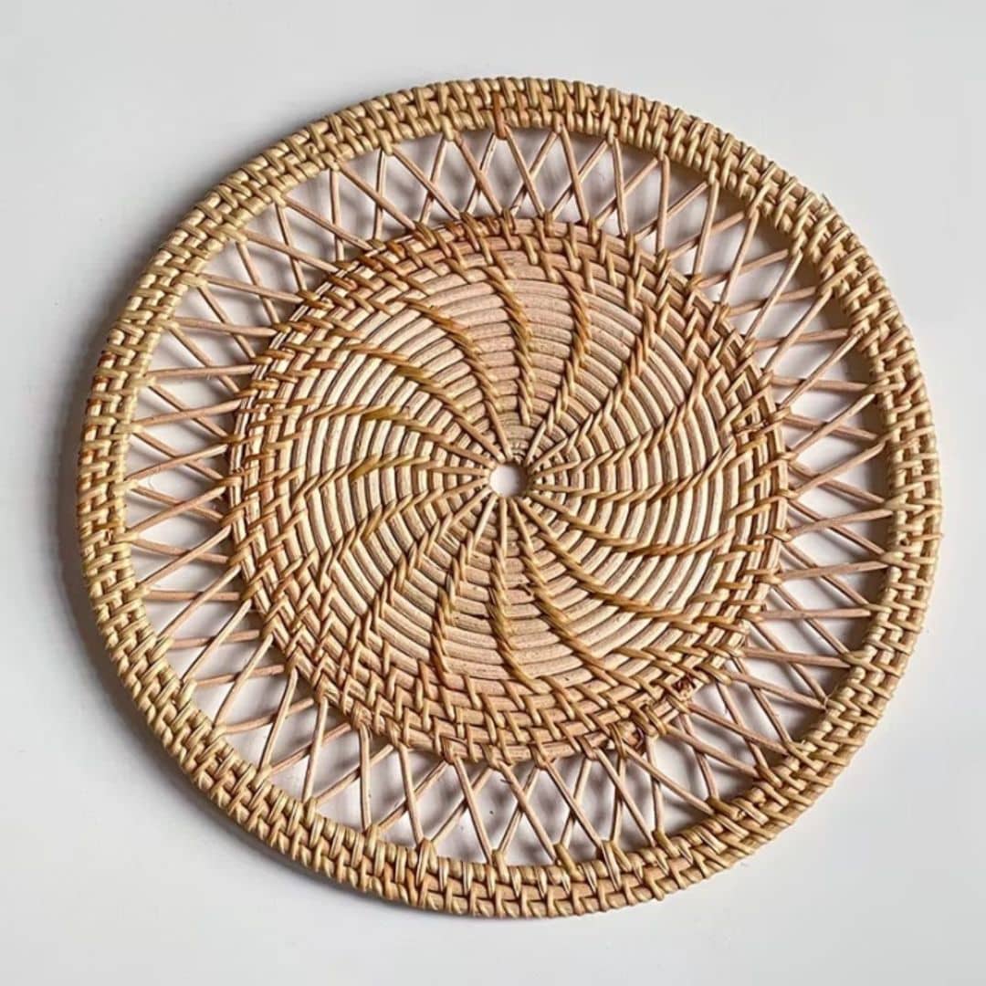 Round straw-look placemat with a radiating sun design – another view