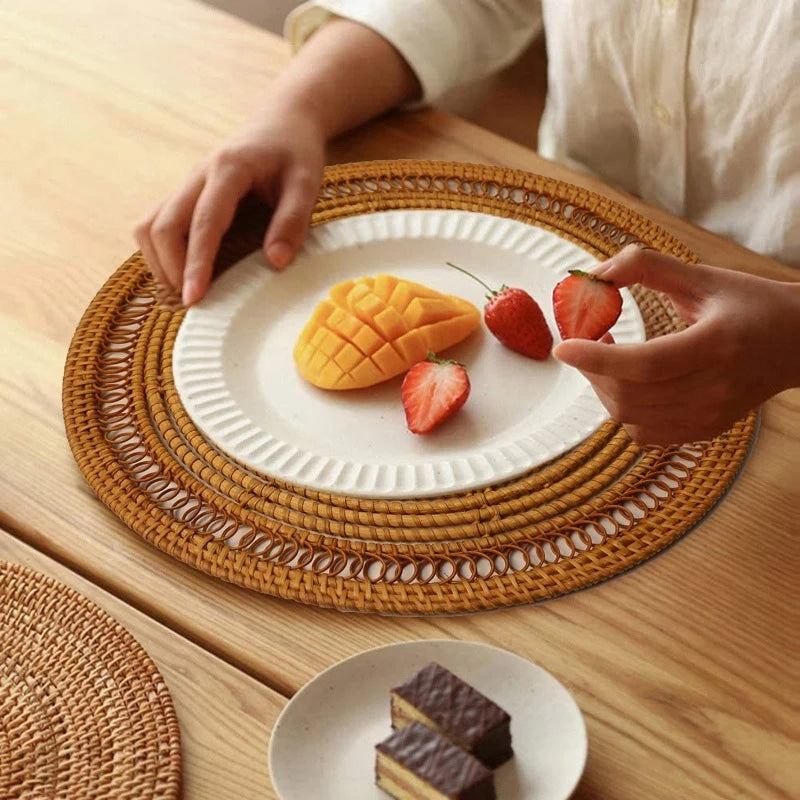 Round woven plastic rattan-look placemat – shown in a room setting
