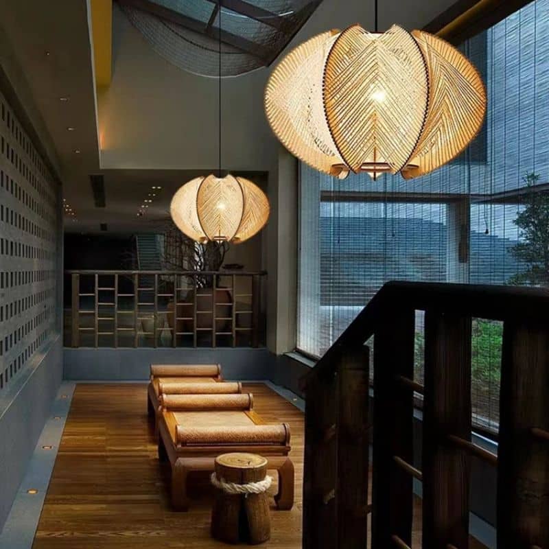 Turned wood and handwoven rattan pendant light – shown lit in a room setting (2)