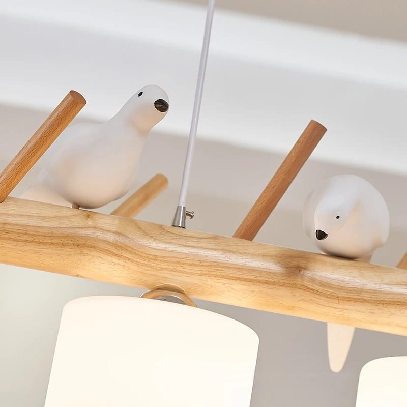 Wood branch pendant light with perched birds – close-up detail