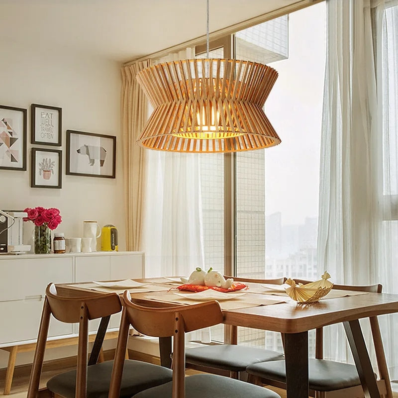 Golden-toned curved wood pendant light – shown in a room setting