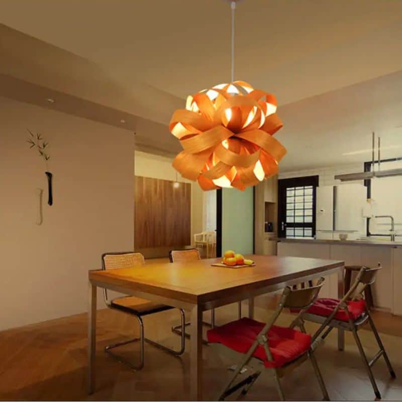 Rounded wood slat pendant light – shown lit in a room setting