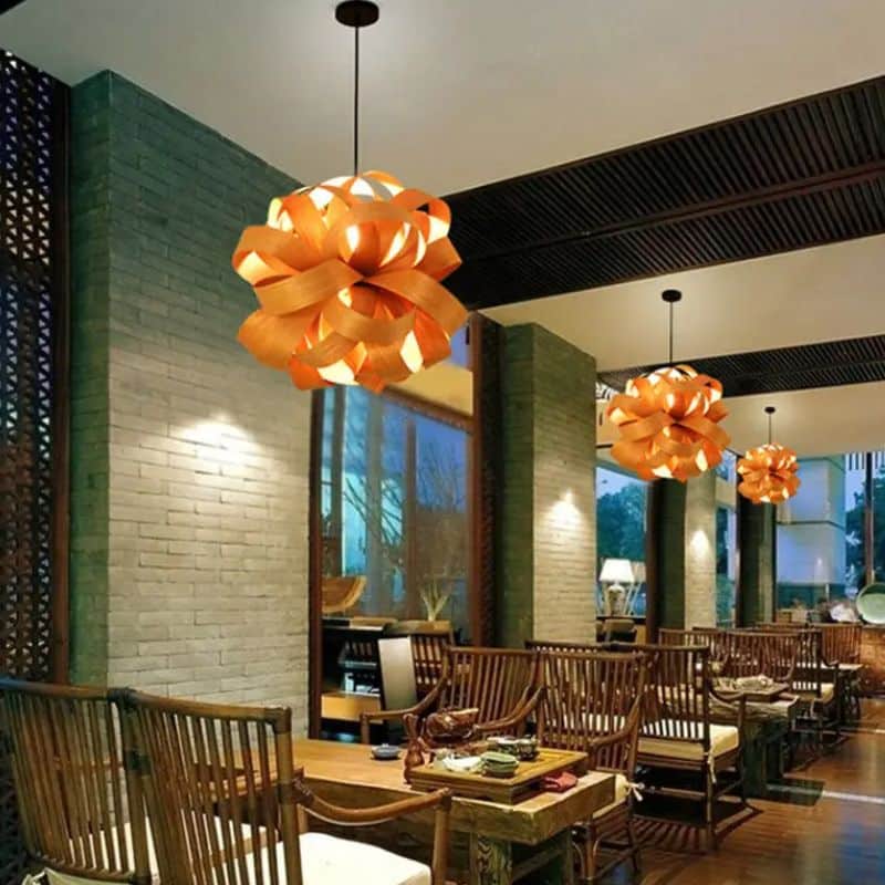 Rounded wood slat pendant light – shown lit in a room setting (2)