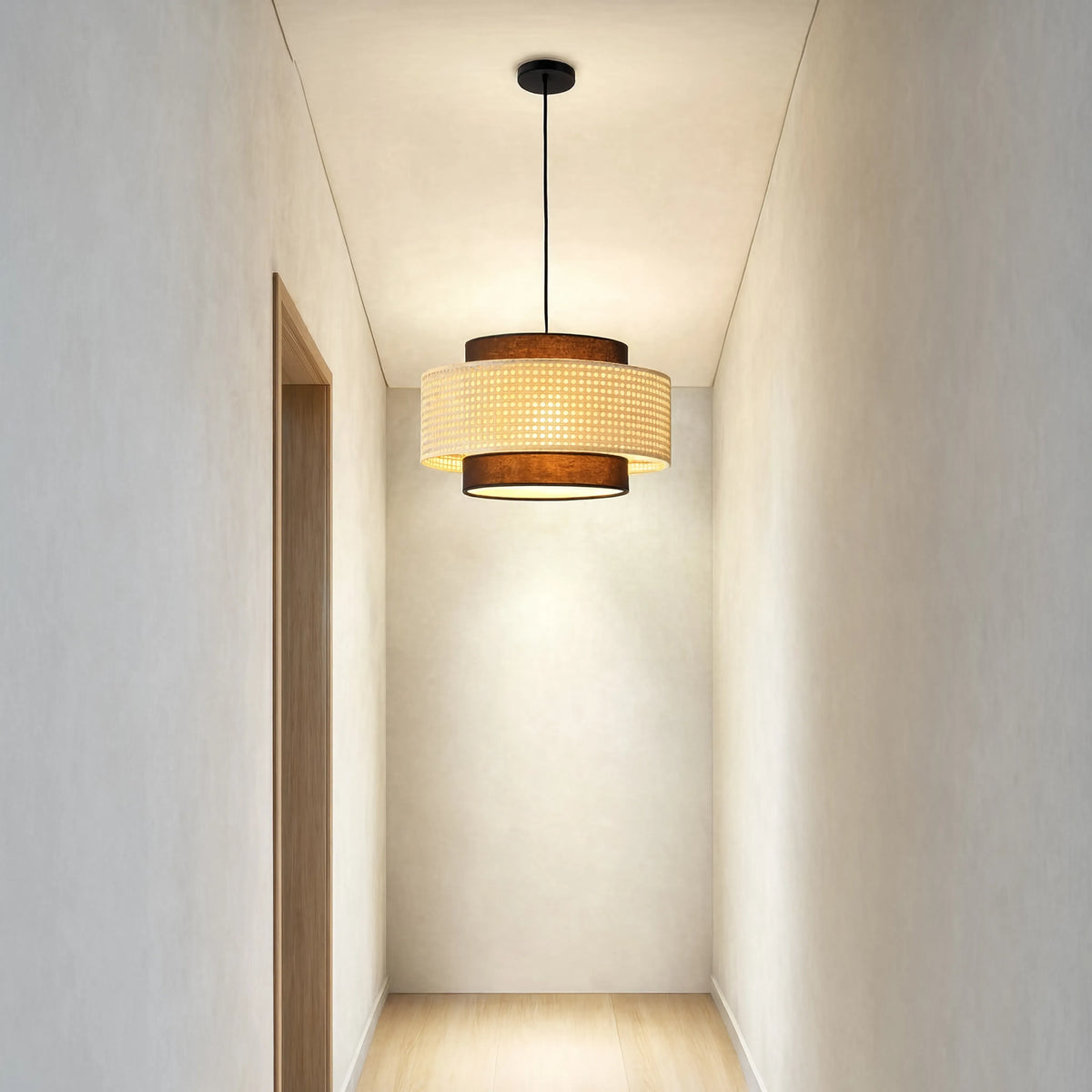 Otrante rattan cane drum pendant light – shown in a hallway