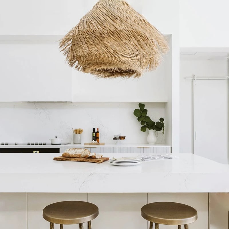 Straw-look woven pendant light with three LEDs – shown in a room setting