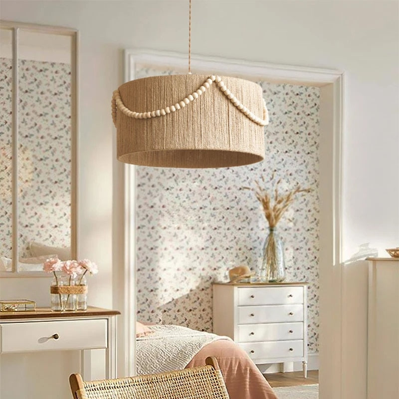 Retro rattan-look pendant light with wood beads – shown in a room setting (2)
