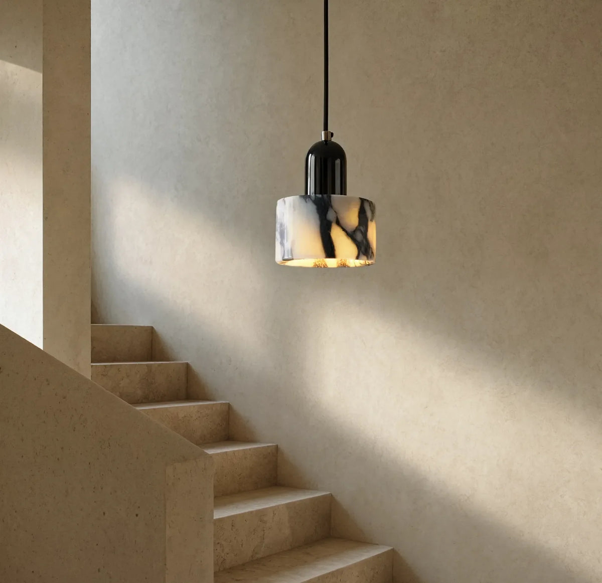 Crotone white marble drum pendant light – shown in a stairwell