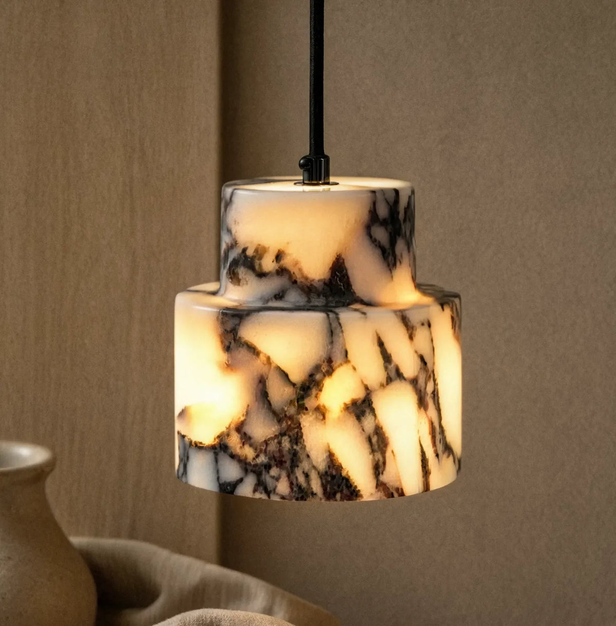 Héraclée two-tier white marble pendant light – shown in a room setting (5)