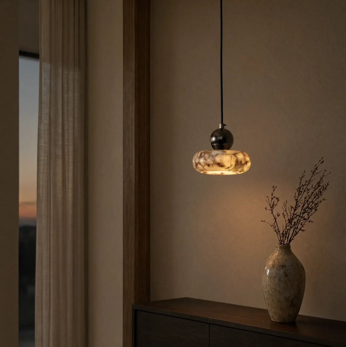 Métaponte marble pebble pendant light – shown in an entryway