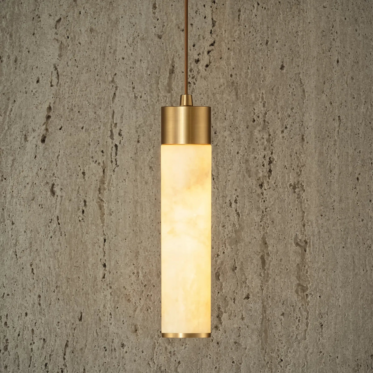 Gela honey marble and brushed brass pendant light – shown in a room setting (2)