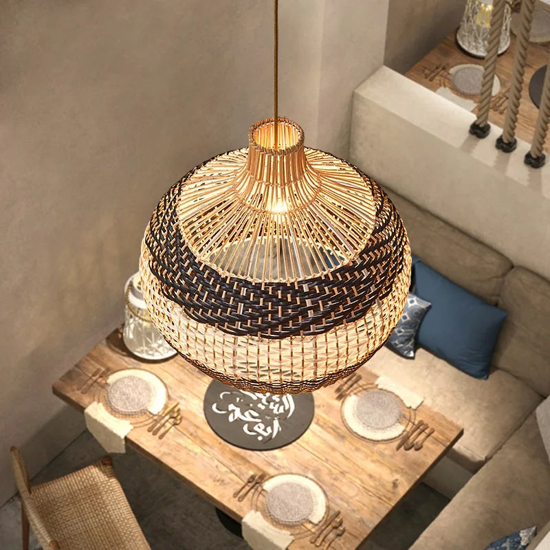 Modern rounded handwoven wicker pendant light – shown in a room setting