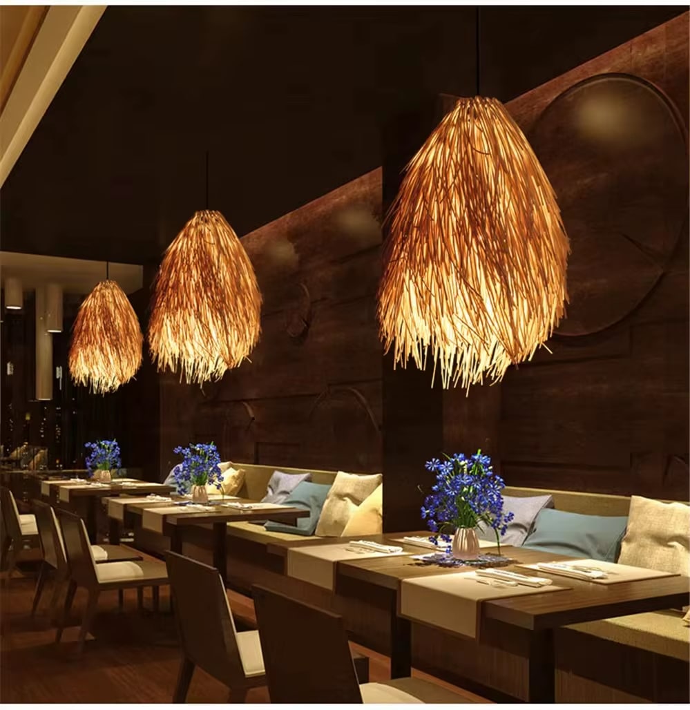 Modern geometric woven pendant light on an iron frame – shown lit in a room setting