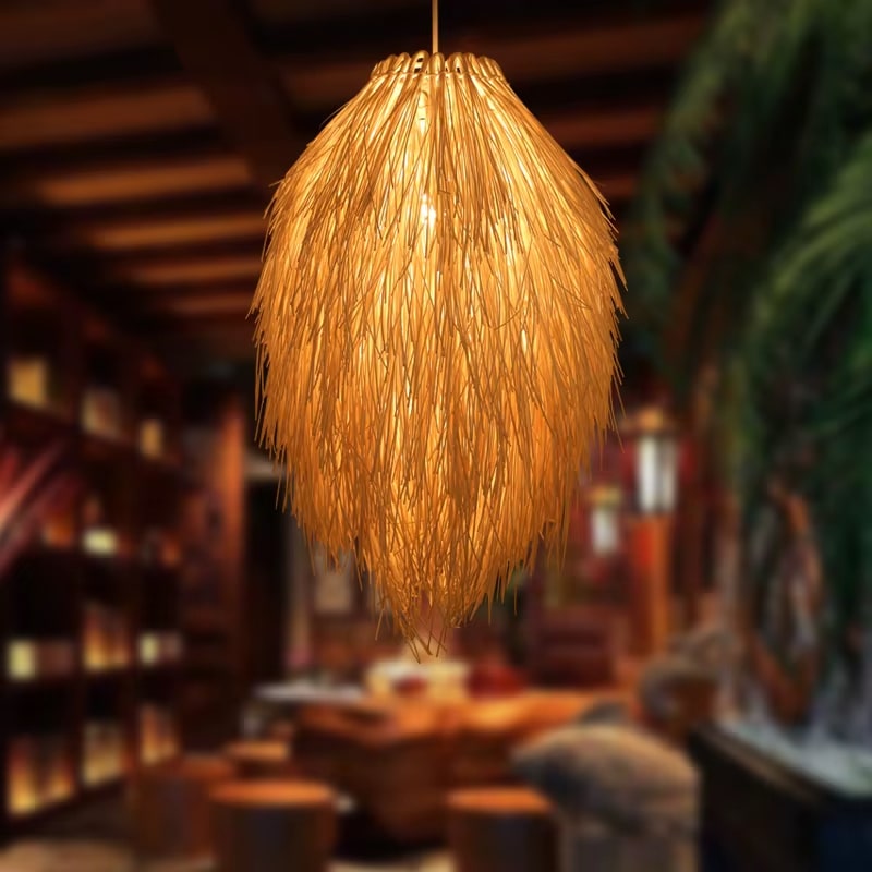 Modern geometric woven pendant light on an iron frame – shown lit