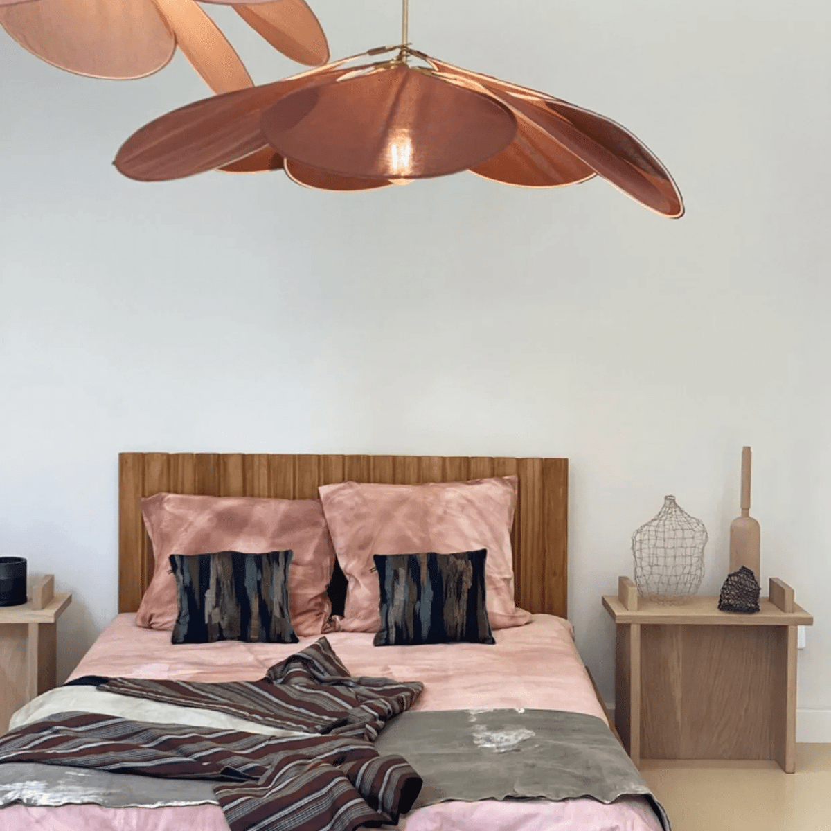 Rattan-look fabric petal pendant light with wide flared petals – shown in a room setting (4)
