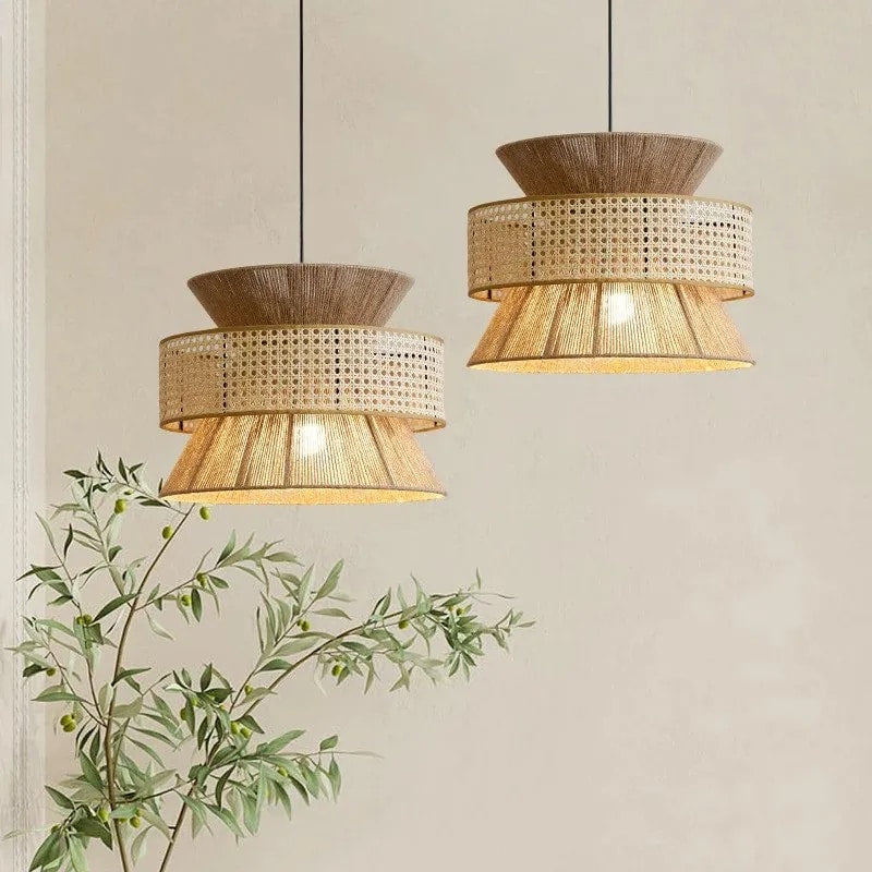Woven natural rattan pendant light with a slim metal frame – shown in a room setting