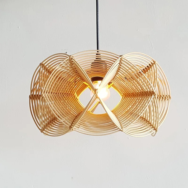 Sculptural handwoven openwork rattan pendant light – shown lit