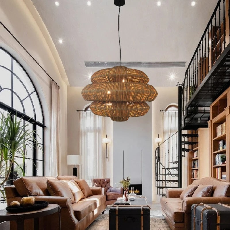 Open rattan pendant light with a central knot detail – shown in a room setting