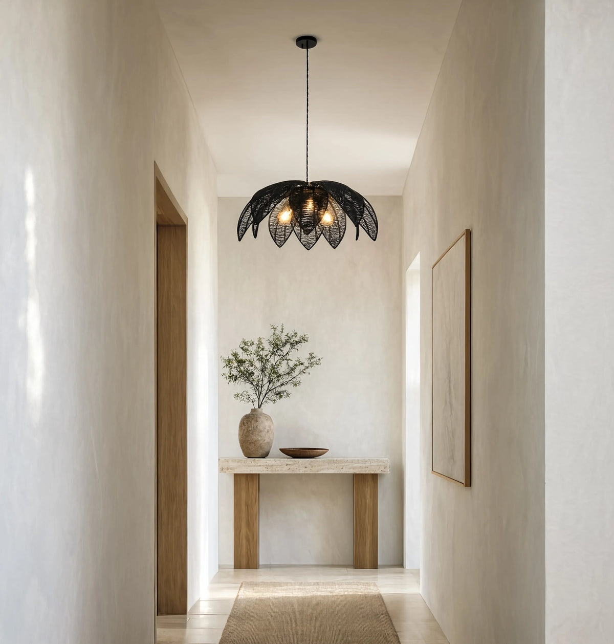 Céfalu rattan palm leaf flower pendant light – shown in a hallway