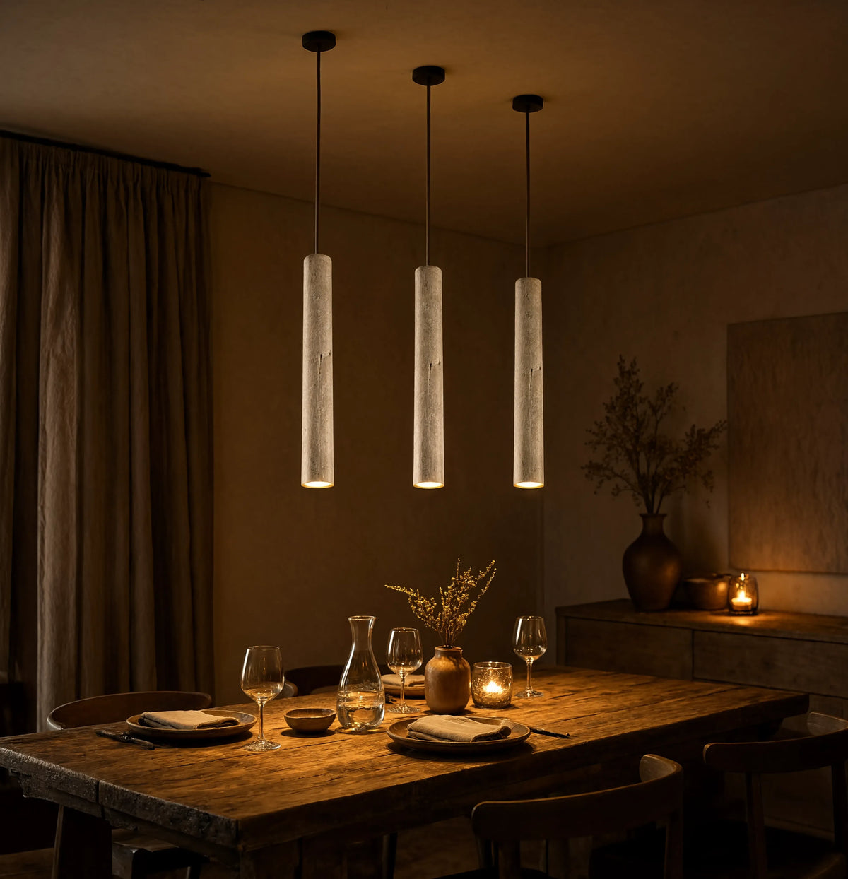 Cumes long travertine tube pendant light – shown in a dining room (3)